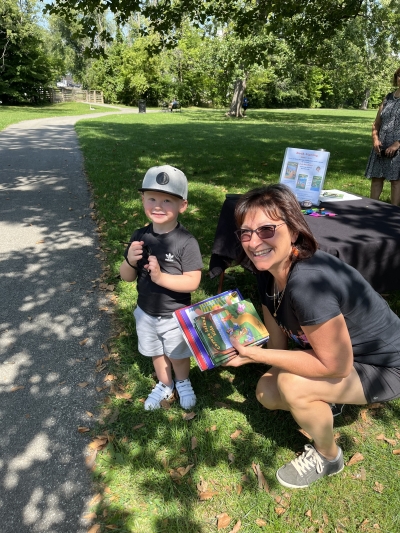 Judy and Joe Joe with his books resized Cayuga Island Kids Event
