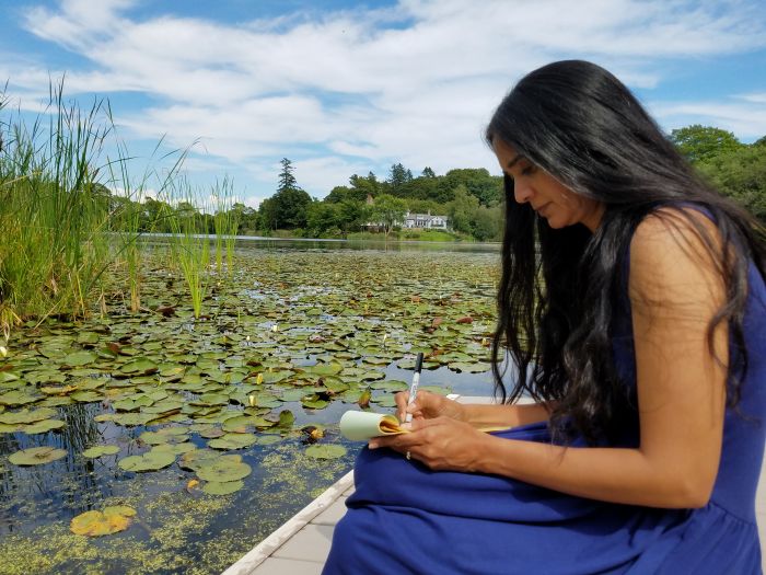 Padma writing on the dock